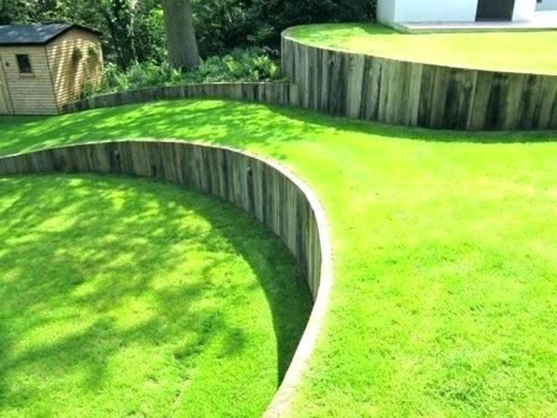 a-garden-with-green-grass-and-stepping-stones